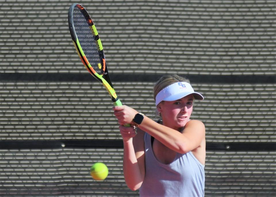 Cooper's Helena Bridge serves the ball in the opening match of the Region I-5A tennis tournament Monday at the McLeod Tennis Center in Lubbock.