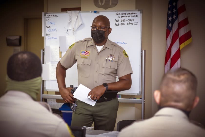 SAN BERNARDINO, CA -JULY27: San Bernardino County Sheriff's Deputy Chief Horace Boatwright, center, speaks at an early morning briefing. San Bernardino Sheriff's Headquarters on Monday, July 27, 2020 in San Bernardino, CA. (Irfan Khan/Los Angeles Times)