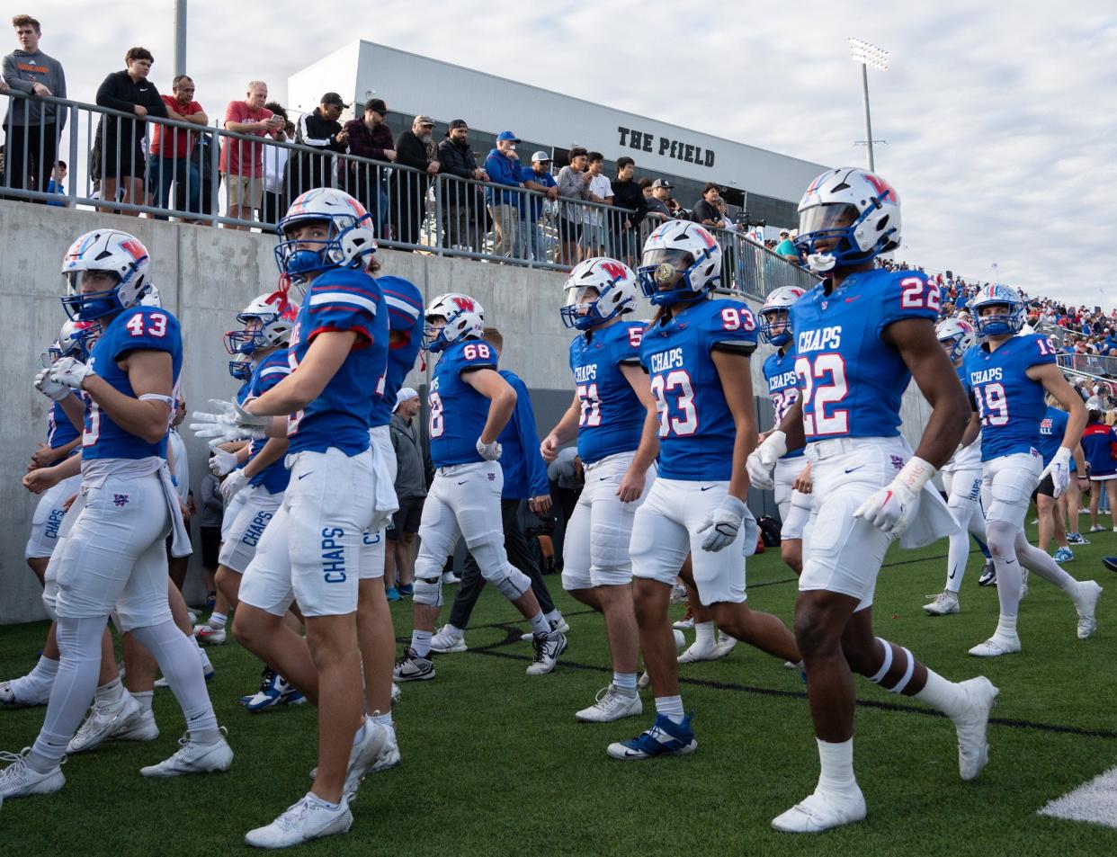 Westlake heads for the locker room at half time in the 6A UIL high school football semifinal game at the Pfield in Pflugerville, Saturday, December 9, 2023. North Shore defeated Westlake 23-14, knocking them out of the playoffs.
