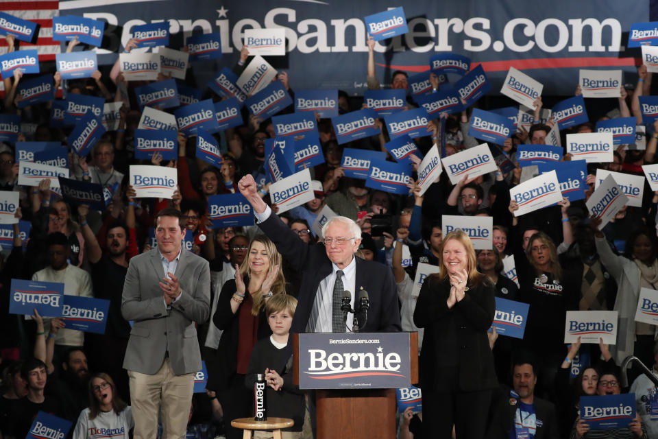 Democratic presidential candidate Sen. Bernie Sanders, I-Vt., with his wife Jane O'Meara Sanders, right, and other family members, speaks at a caucus night campaign rally in Des Moines, Iowa, Monday, Feb. 3, 2020. (AP Photo/Pablo Martinez Monsivais)