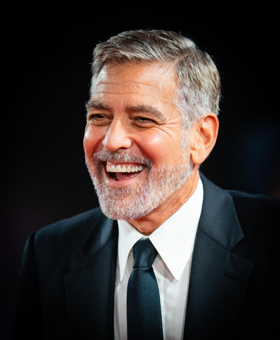 George Clooney laughs at the London premiere of "The Tender Bar" on October 10, 2021
