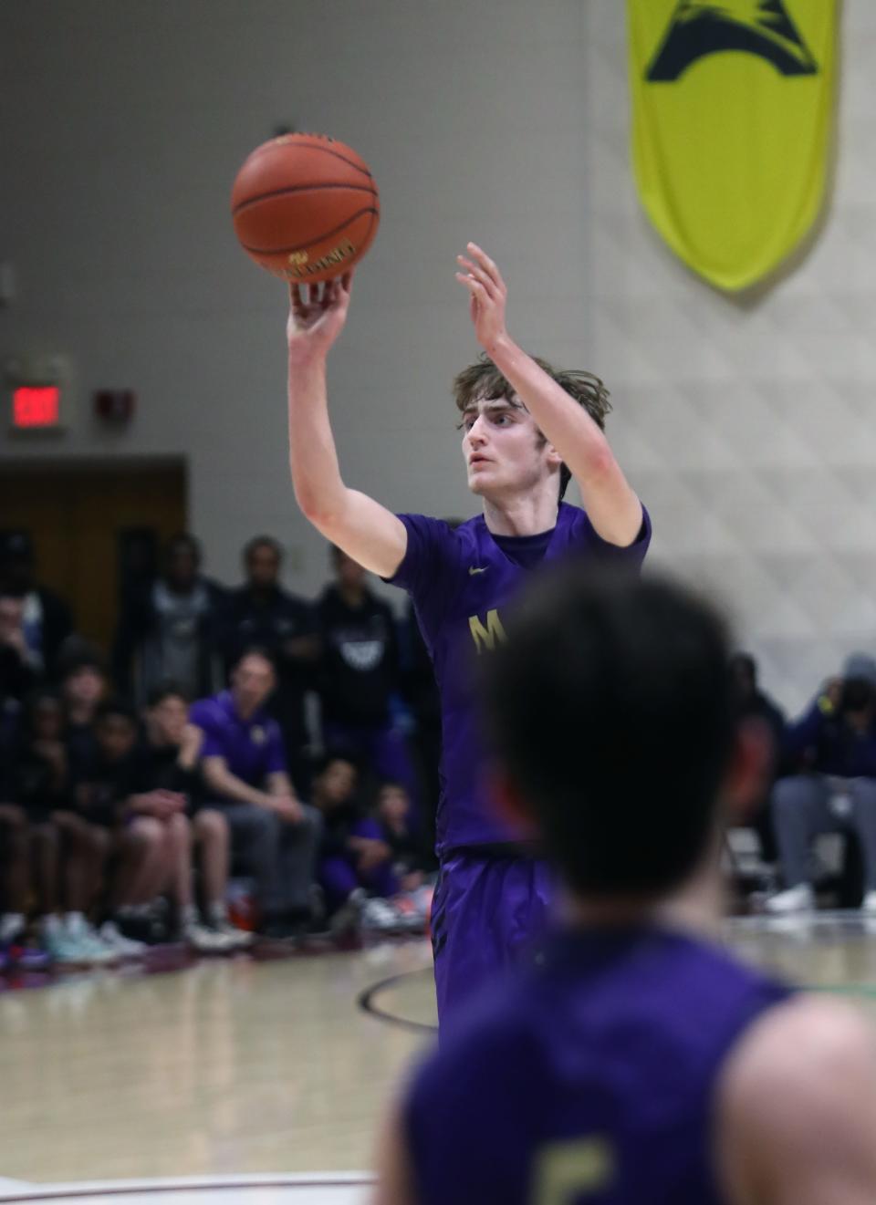 Male’s Cole Edelen makes a three against Trinity in the District 7 Championship game.Mar. 7, 2023