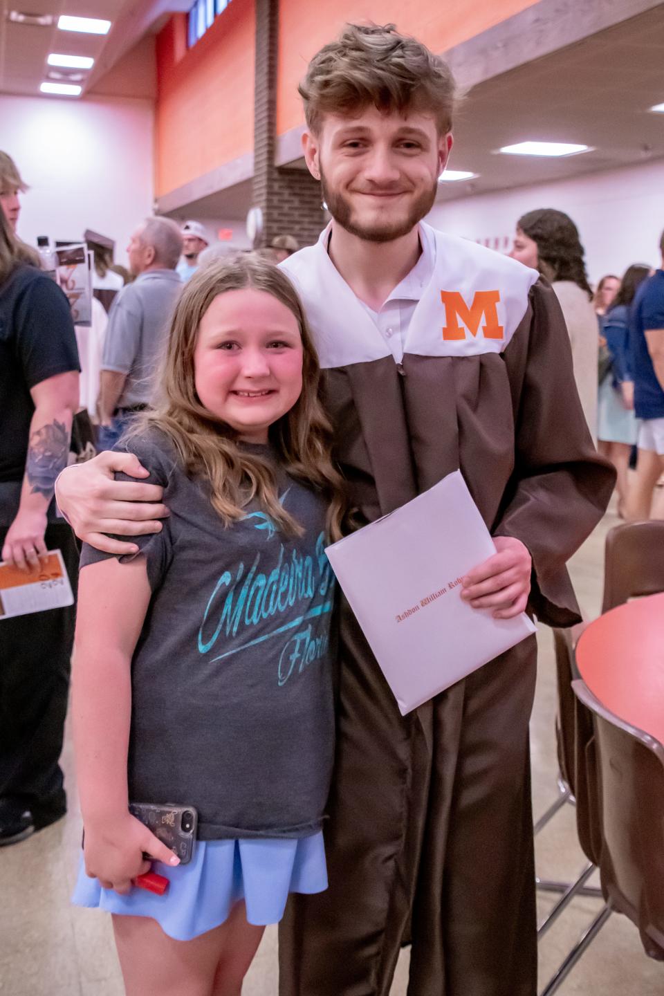 Meadowbrook senior Ashdon Robinson hugs little sister, Luna Garrison after graduation on Friday, May 17. Garrison spent almost the entirety of the ceremony in tears as she watched her brother with pride.