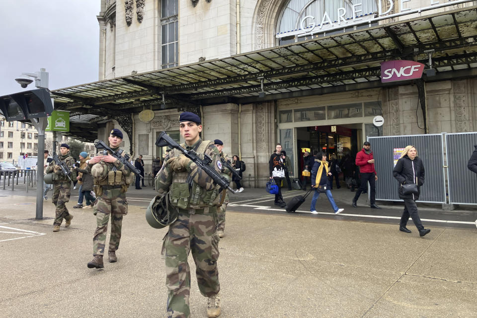 Soldiers patrol outside the Gare de Lyon station after an attack, Saturday, Feb. 3, 2024 in Paris. A man injured three people Saturday in a stabbing attack at the major Gare de Lyon train station in Paris, another nerve-rattling security incident in the Olympic host city before the Summer Games open in six months. (AP Photo/Christophe Ena)