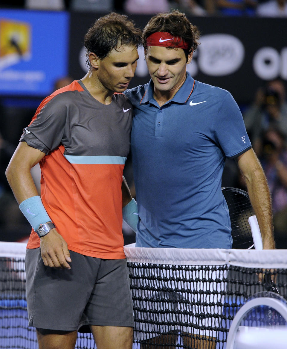 Rafael Nadal of Spain, left, is congratulated by Roger Federer of Switzerland at the net after Nadal won their semifinal final at the Australian Open tennis championship in Melbourne, Australia, Friday, Jan. 24, 2014.(AP Photo/Andrew Brownbill)