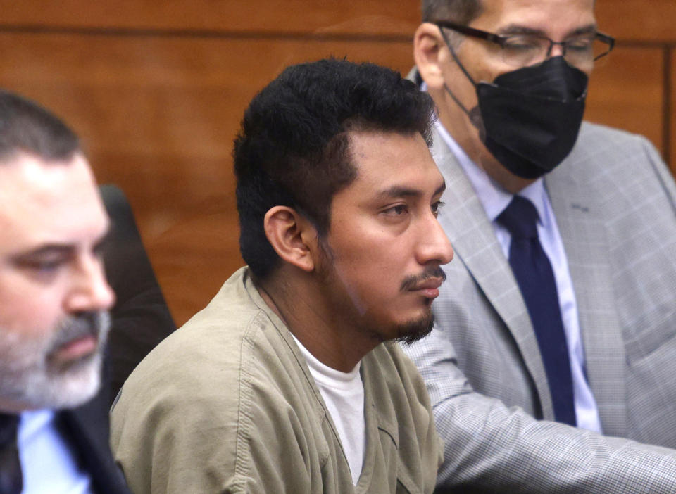 Gerson Fuentes, center, in Franklin County common pleas court for his bond hearing in Columbus, Ohio, (Paul Vernon / AP file )