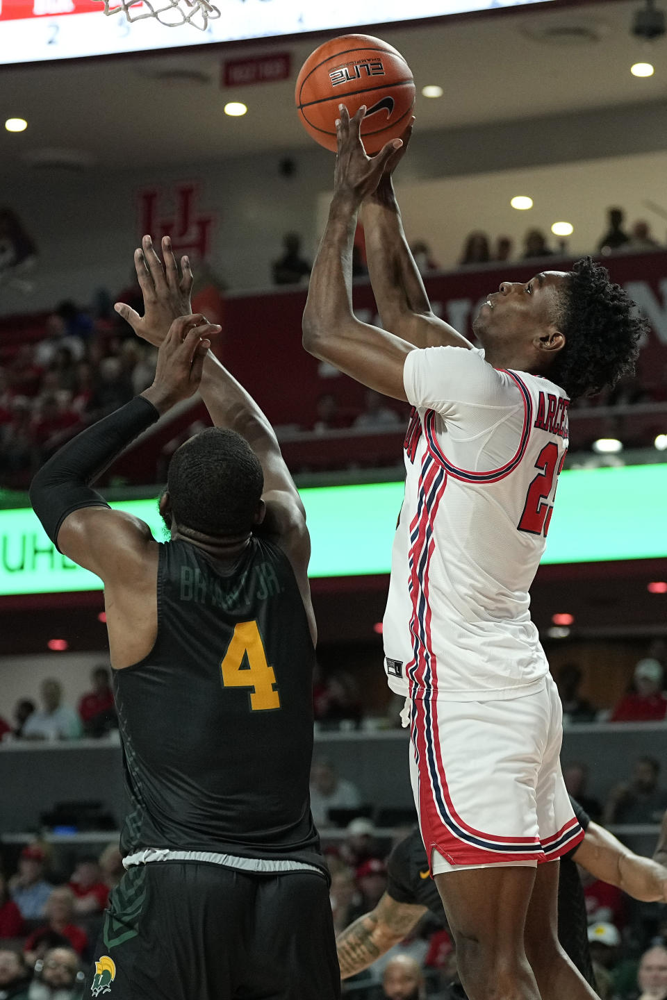 Houston guard Terrance Arceneaux, right, scores over Norfolk State guard Joe Bryant Jr. (4) during the first half of an NCAA college basketball game, Tuesday, Nov. 29, 2022, in Houston. (AP Photo/Kevin M. Cox)