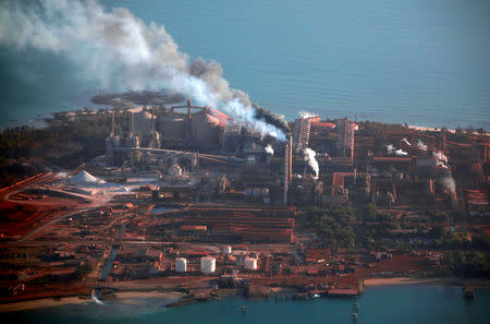 FILE PHOTO: Chimneys billow smoke at the Rio Tinto alumina refinery in Gove, also known as Nhulunbuy, located 650 km (404 miles) east of Darwin in Australia's Northern Territory July 16, 2013. REUTERS/David Gray/File Photo