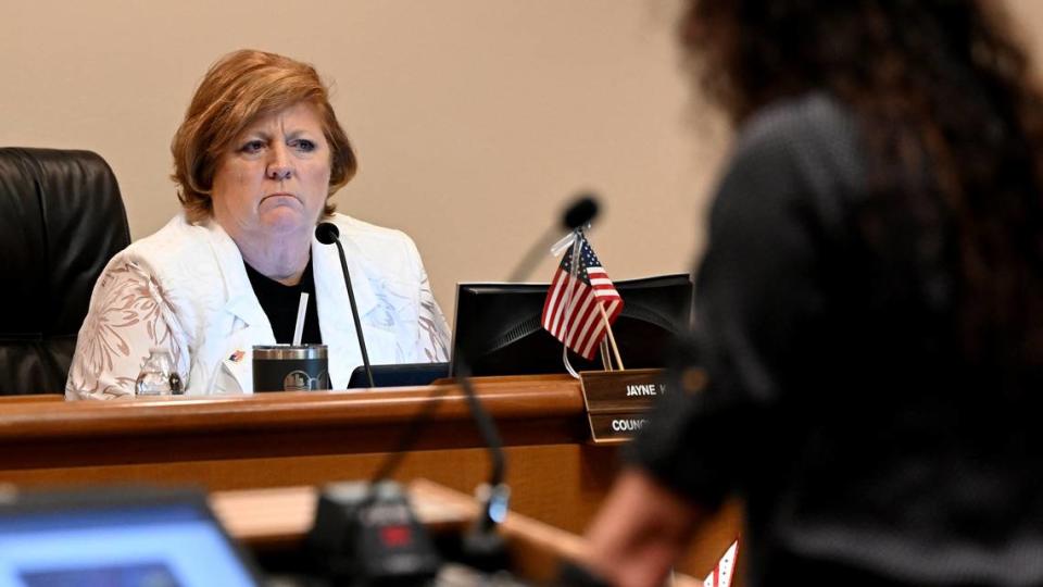 Jayne Kocher listens to a speaker during a meeting where the Bradenton City Council approved an agreement that allows for the construction of a hotel, 350 apartments, 95 condos, and retail space on waterfront land in downtown in a meeting on July 24, 2024.