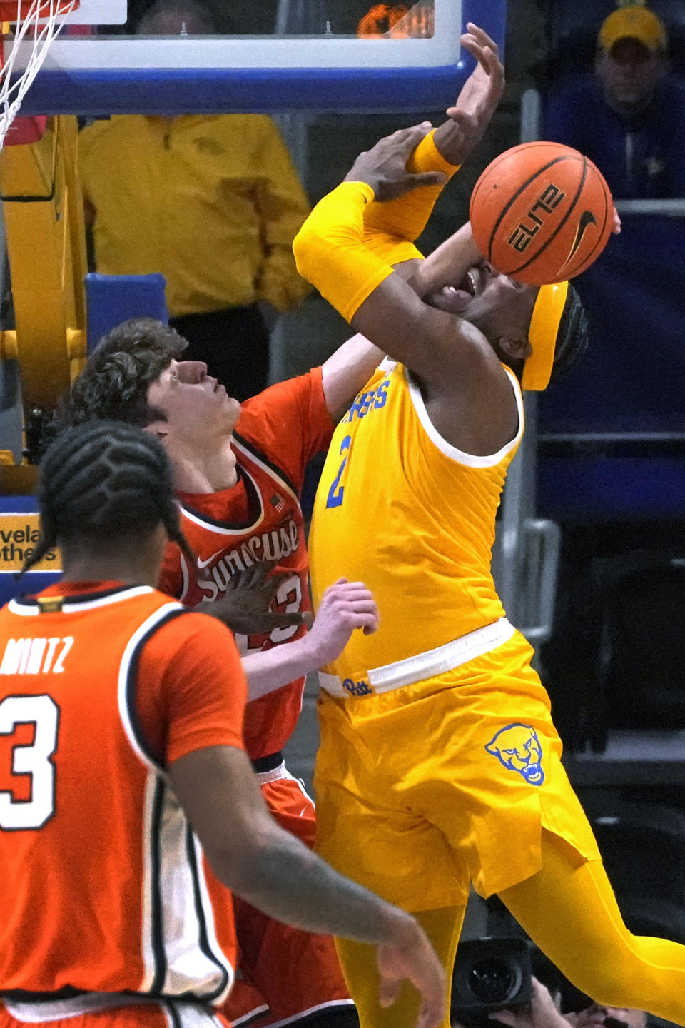 Pittsburgh's Blake Hinson (2) is fouled by Syracuse 's Peter Carey during the first half of an NCAA college basketball game in Pittsburgh on Tuesday, Jan. 16, 2024. (AP Photo/Gene J. Puskar)