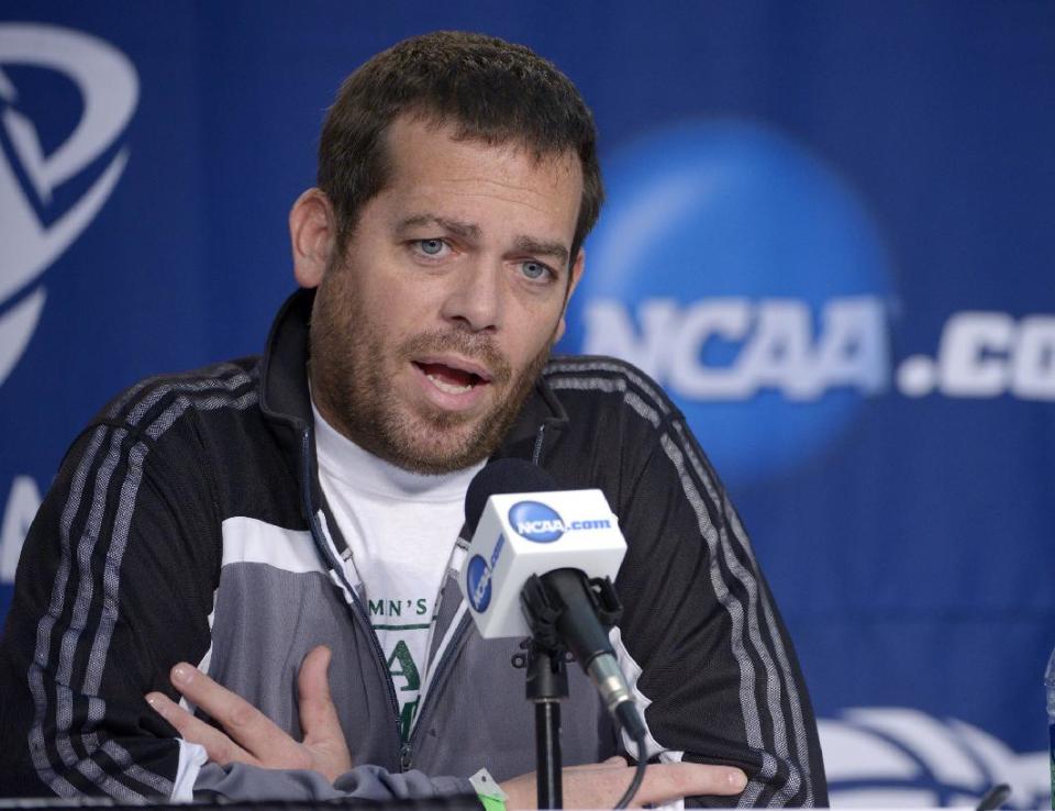 Manhattan coach Steve Masiello speaks during a news conference for the NCAA men's college basketball tournament, Wednesday, March 19, 2014, in Orlando, Fla. Manhattan will play Louisville in a second-round game Thursday. (AP Photo/Phelan Ebenhack)