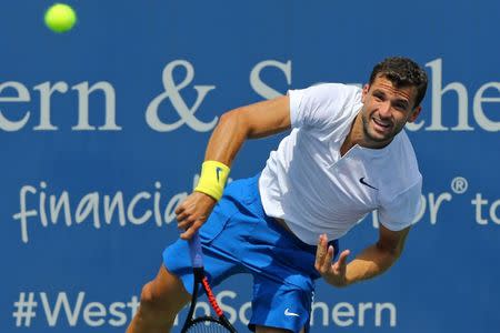 Aug 19, 2017; Mason, OH, USA; Grigor Dimitrov (ESP) serves against John Isner (USA) during the Western and Southern Open at the Lindner Family Tennis Center. Mandatory Credit: Aaron Doster-USA TODAY Sports