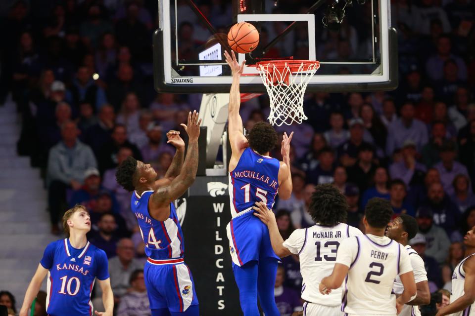 Kansas graduate senior guard Kevin McCullar Jr. (15) lays in for two during a Feb. 5 game earlier this year at Kansas State inside Bramlage Coliseum.