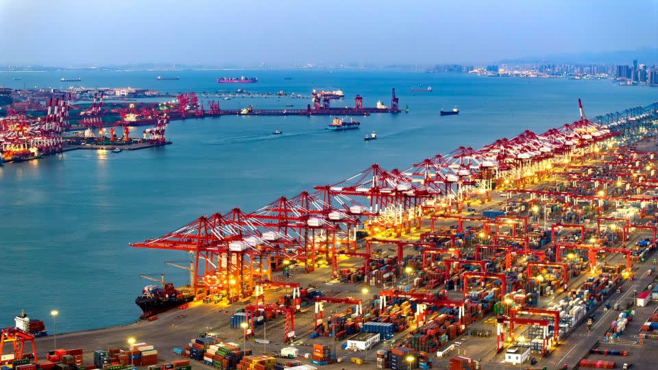 A container ship is loaded at a terminal in northeastern China's Qingdao Port earlier this month. - Costfoto/NurPhoto/Getty Images