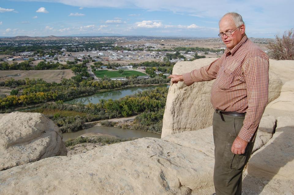 Tommy Bolack stands on the Shannon Bluffs overlooking his B-Square Ranch, the San Juan River and the city of Farmington after he placed the property in two conservation easements in September 2021.