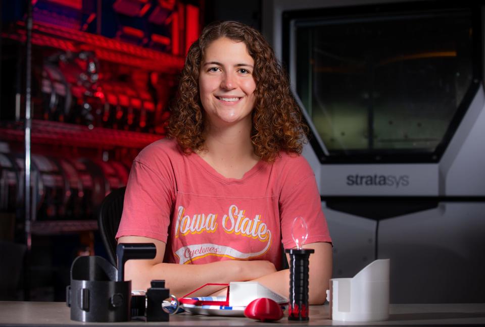 Cassie Swacker, graduating in mechanical engineering and biomedical engineering, with some of her 3D-printed life aides inside Black Engineering’s 3D printing lab. She worked with CIRAS to line up an internship with On With Life to design custom tools for patients using 3D printing technology.