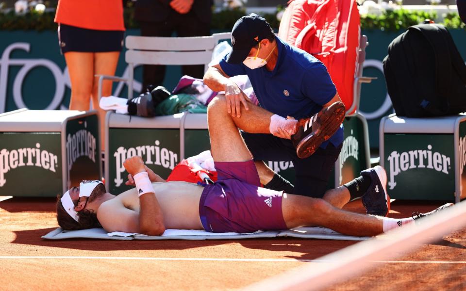 Tsitsipas receives treatment at the end of the third set - Getty Images