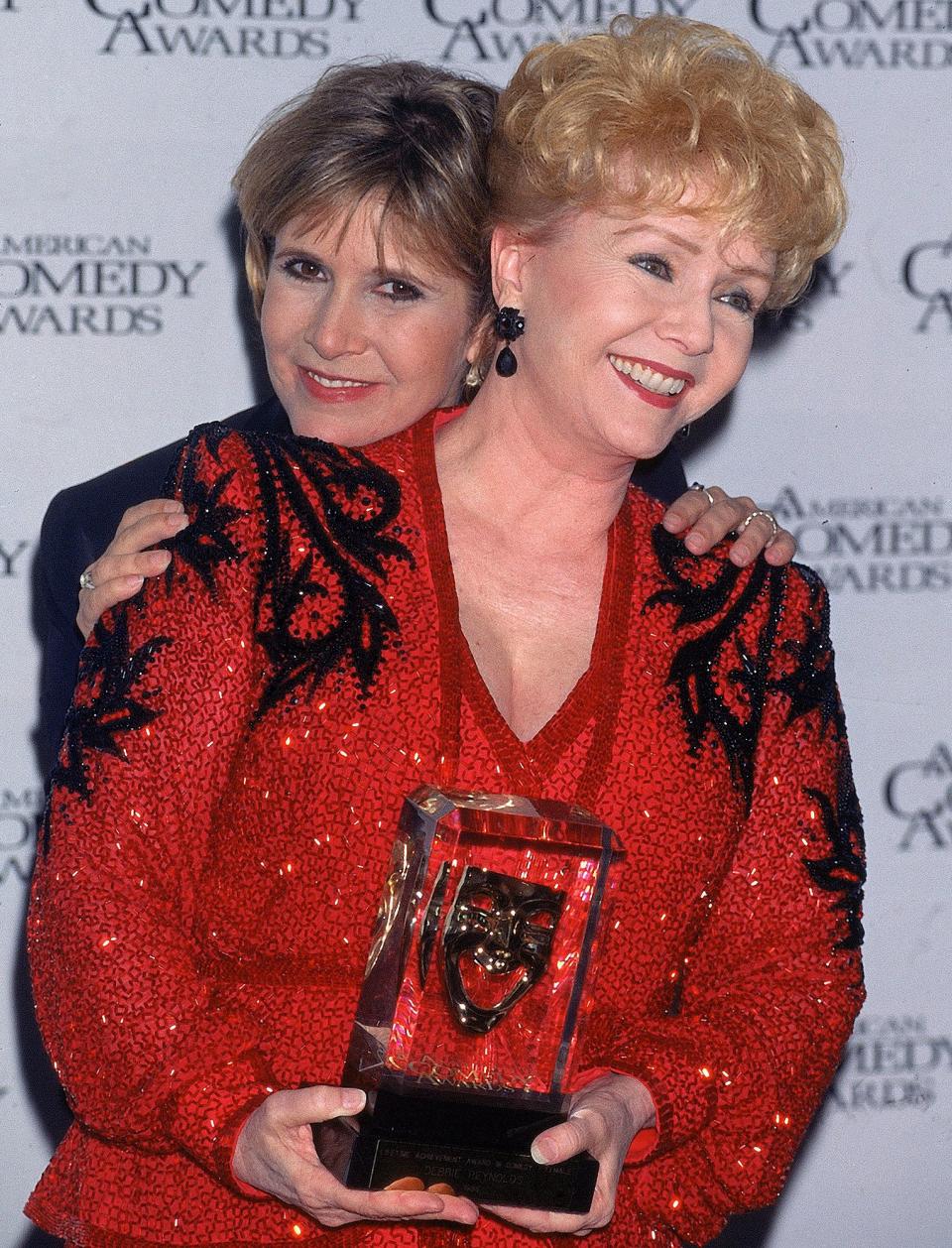 At the 11th annual American Comedy Awards in L.A. in 1997, at which Reynolds was honored. 