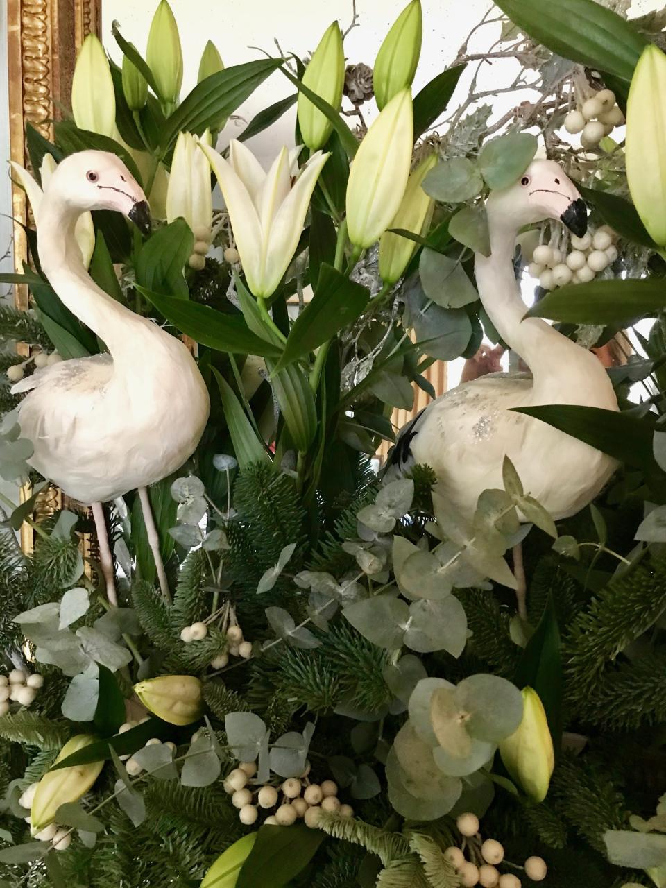 I love our white flamingos nestled amongst the fresh eucalyptus and lilies.