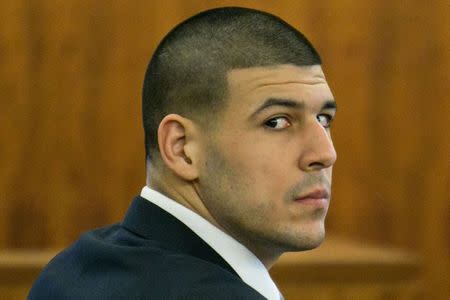 Former New England Patriots player Aaron Hernandez listens during his murder trial at the Bristol County Superior Court in Fall River, Massachusetts, February 18, 2015. REUTERS/Dominick Reuter