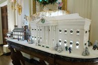 A gingerbread replica of the White House and a sugar cookie replica of Independence Hall are on display in the State Dining Room of the White House during a press preview of holiday decorations at the White House, Monday, Nov. 28, 2022, in Washington. (AP Photo/Patrick Semansky)