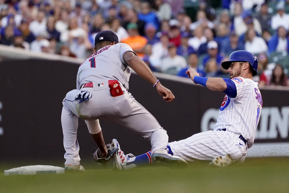 Cleveland Indians' Amed Rosario (1) catches Chicago Cubs' Eric Sogard, right, trying to steal second to end the third inning of a baseball game Monday, June 21, 2021, in Chicago. (AP Photo/Charles Rex Arbogast)