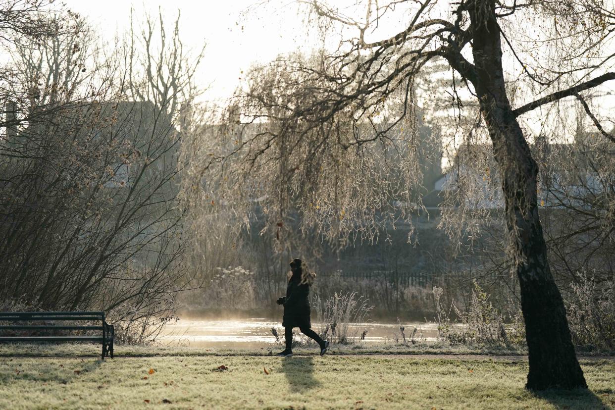 People walk along the river Avon during a frosty morning in St Nicholas' Park in Warwick. Picture date: Wednesday December 6, 2023. (Photo by Jacob King/PA Images via Getty Images)