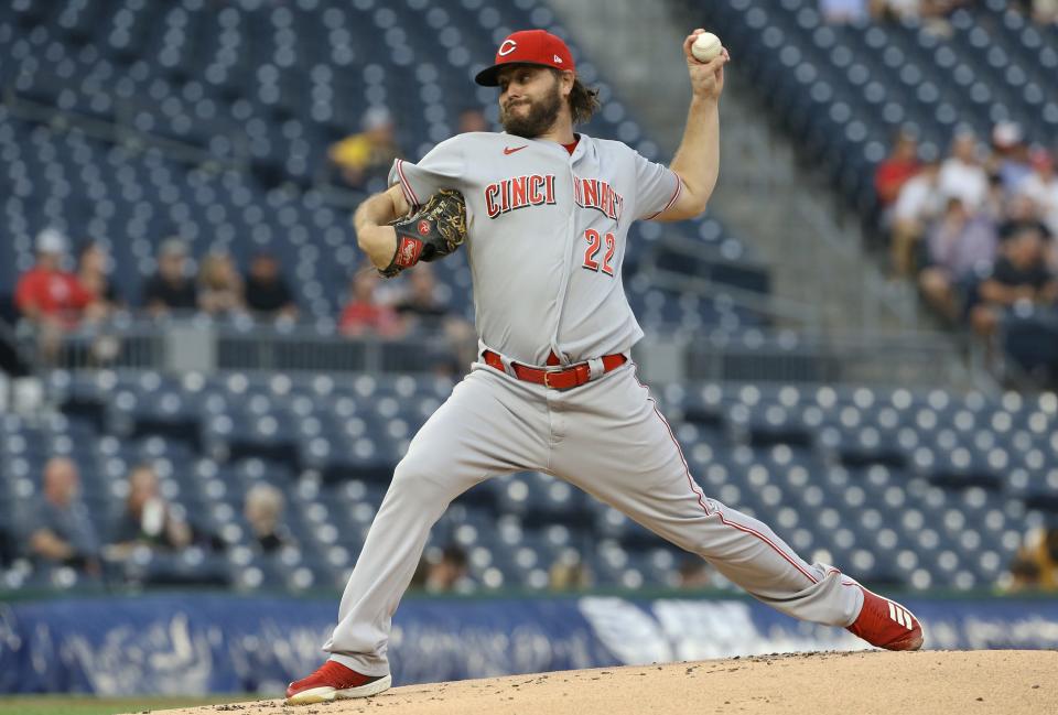 Sep 14, 2021; Pittsburgh, Pennsylvania, USA; Cincinnati Reds starting pitcher Wade Miley (22) delivers against the Pittsburgh Pirates during the first inning at PNC Park. Mandatory Credit: Charles LeClaire-USA TODAY Sports