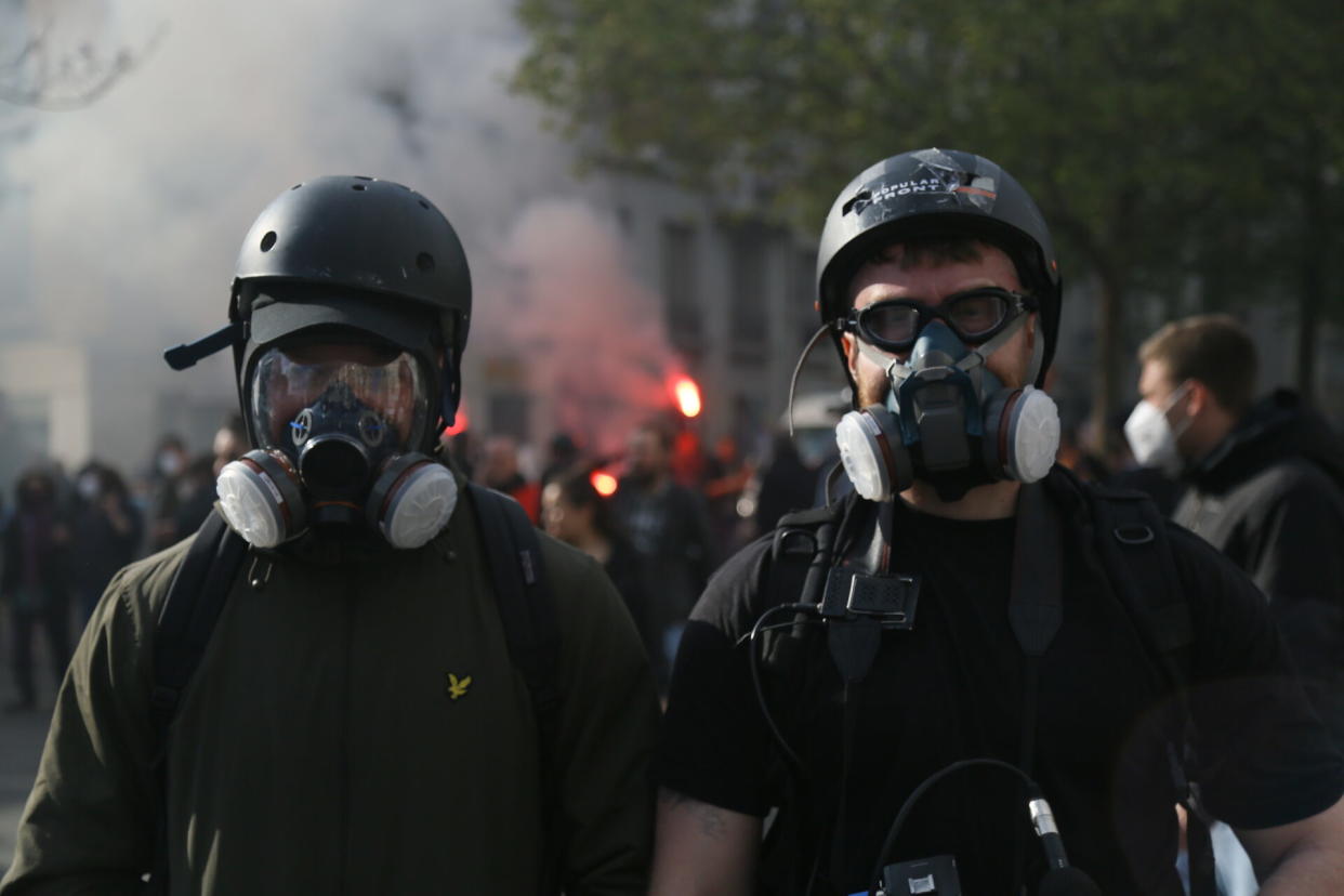 Into the fray: Jake Hanrahan (left) and his cameraman Luke Pierce near Place de la Nation, Paris, during this year’s May Day riots (Picture: R Seventeen)