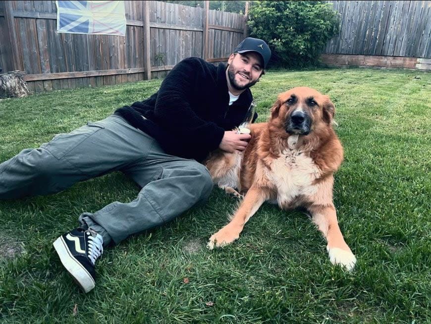 Matthew Smith poses with his dog Bentley. Smith says he's proud to be a Newfoundlander.