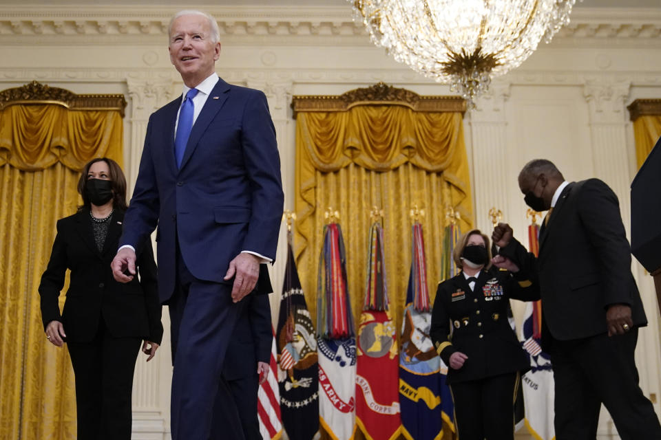 President Joe Biden leaves with Vice President Kamala Harris and Defense Secretary Lloyd Austin after speaking during an event to mark International Women's Day, Monday, March 8, 2021, in the East Room of the White House in Washington. (AP Photo/Patrick Semansky)