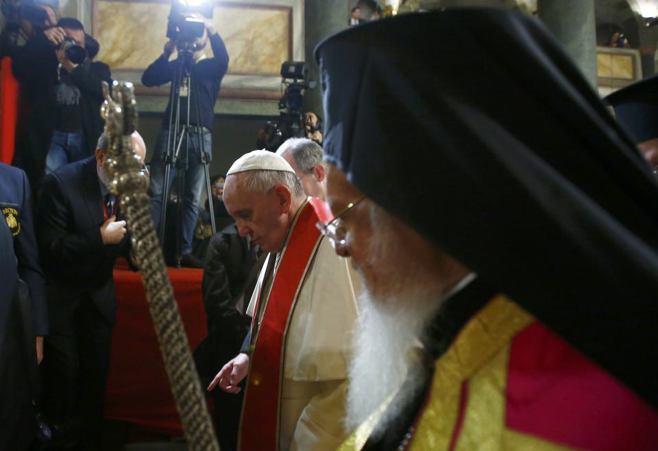 Pope Francis and Ecumenical Patriarch Bartholomew I of Constantinople (R) leave after an Ecumenical Prayer at the Patriarchal Church of Saint George in Istanbul November 29, 2014. Pope Francis began a visit to Turkey on Friday with the delicate mission of strengthening ties with Muslim leaders while condemning violence against Christians and other minorities in the Middle East. (REUTERS/Tony Gentile)