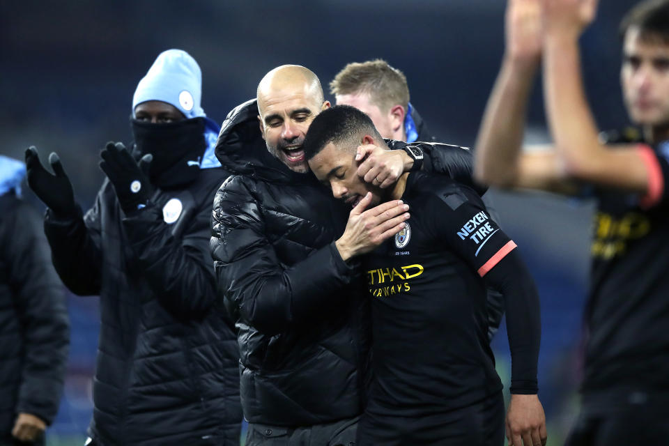 Pep Guardiola embraces Jesus after his performance (Martin Rickett/PA Wire)