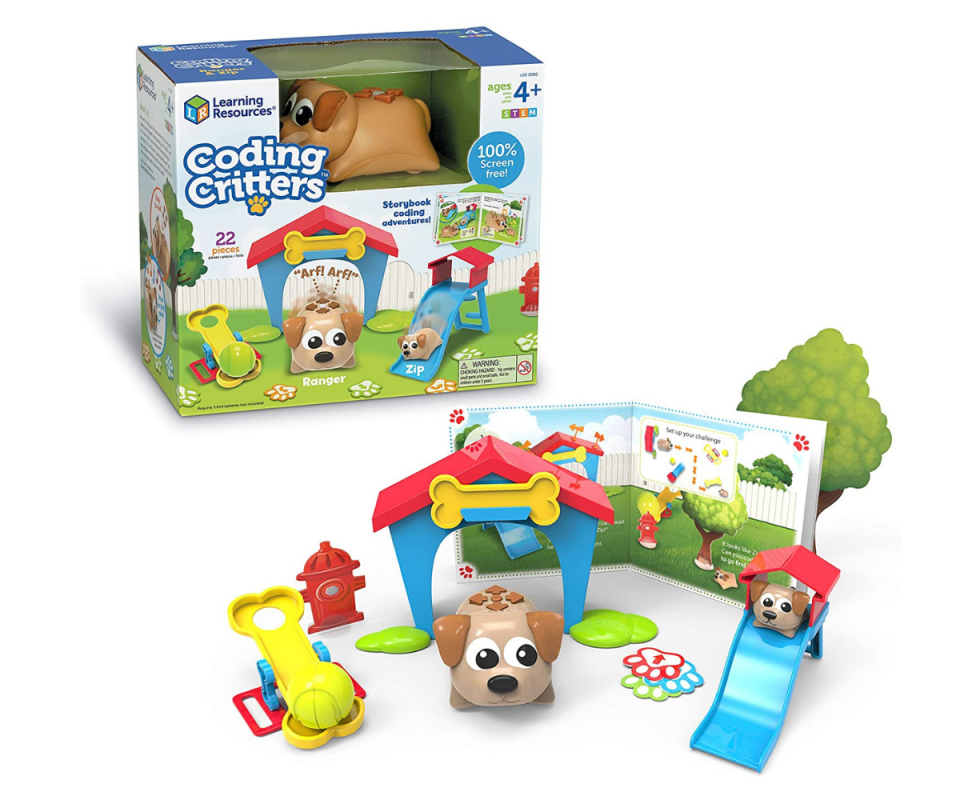 Coding Critters toy in the box on a white background with the toy assembled in front, including two brown toy dogs in a kennel and on a blue slide.