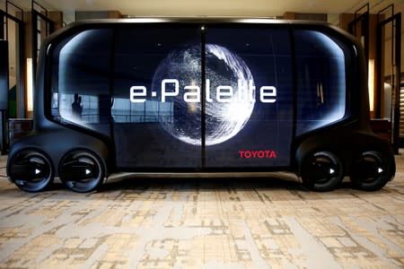 FILE PHOTO : A mock of self-driving car e-Palette is displayed at a news conference by Monet Technologies Inc., a joint venture of SoftBank Corp and Toyota Motor Corp that will develop self-driving car services, in Tokyo