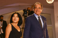 Director Oliver Stone, right, and Sun-jung Jung pose for photographers upon arrival at the un-jung Jung premiere of the film 'Miss Marx' during the 77th edition of the Venice Film Festival in Venice, Italy, Saturday, Sept. 5, 2020. (Photo by Joel C Ryan/Invision/AP)