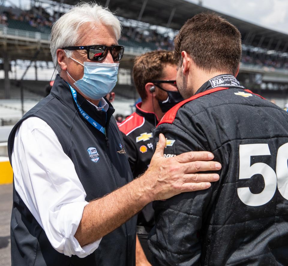 Mark Miles, president and chief executive officer of Penske Entertainment Corp., wishes Team Penske driver Will Power (12) luck Saturday, May 22, 2021, before last row qualifying for the 105th running of the Indianapolis 500 at Indianapolis Motor Speedway. 