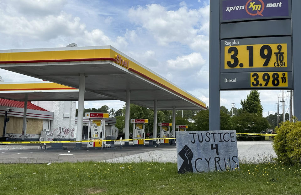 A sign calling for justice is for Cyrus Carmack-Belton is seen outside a gas station on Thursday, June 1, 2023, in Columbia, S.C. Authorities said the station owner shot Carmack-Belton, 14, after the owner wrongly suspected him of shoplifting. (AP Photo/Jeffrey Collins)