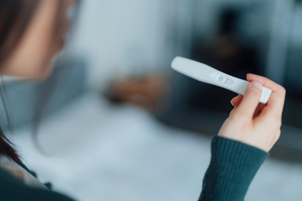 Fertility issues are a common sign of blocked fallopian tubes. (Getty) Cropped shot of a woman holding home pregnancy test and looking surprised. The longest wait ever. Life changing moment. Geriatric pregnancy concept. Am I ready to be pregnant?