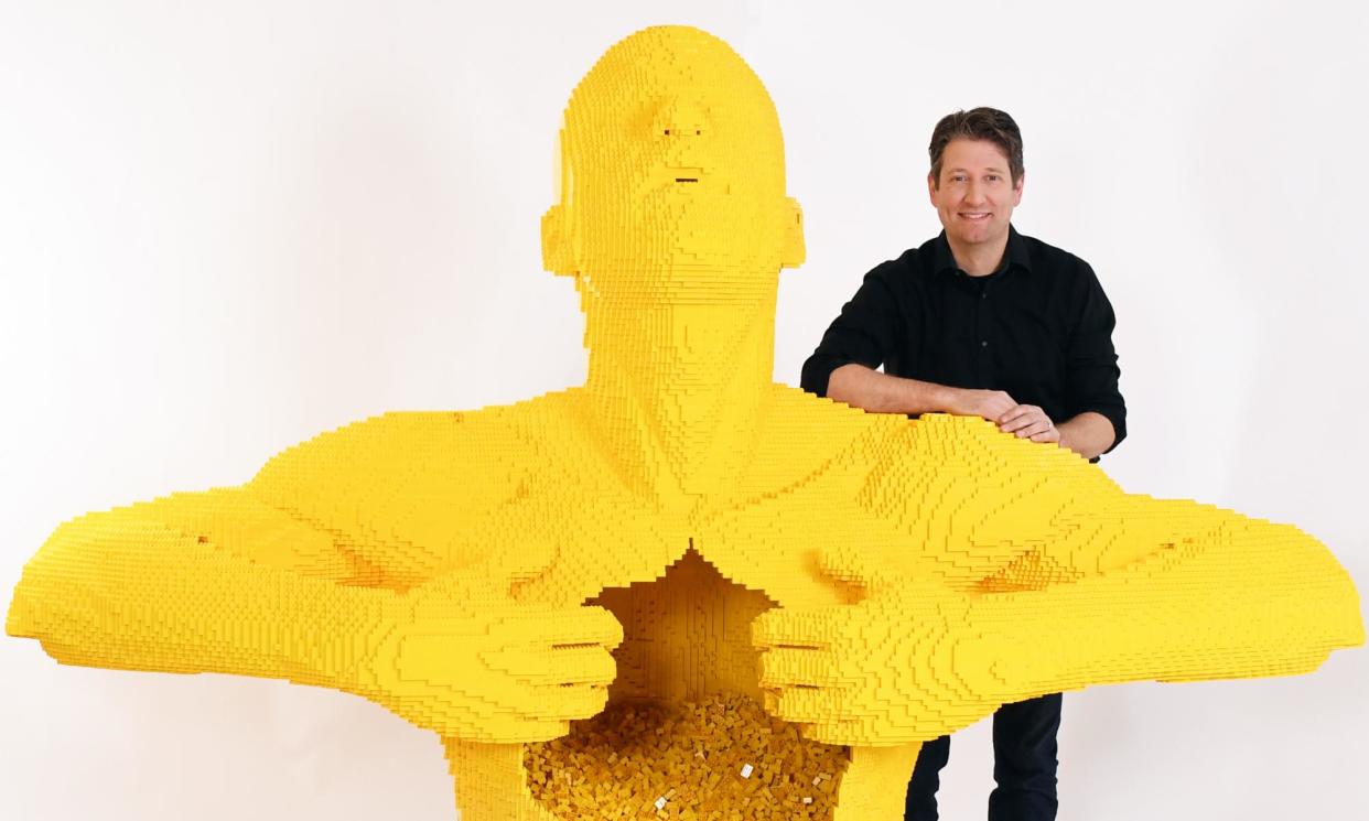 <span>Lego artist Nathan Sawaya with his sculpture Big Yellow. Sawaya’s show the Art of the Brick has opened in Melbourne.</span><span>Photograph: Mitchell Haddad</span>