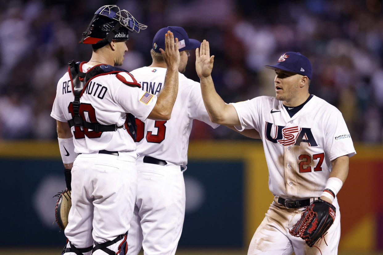 Mike Trout (27) high-fives teammates catcher J.T. Realmuto (10) and pitcher David Bednar (53) after Team USA beat Team Great Britain 6-2 at Chase Field. (Chris Coduto-USA TODAY Sports)
