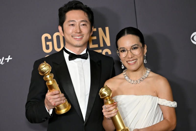 Steven Yeun and Ali Wong appear backstage with their awards for "Beef" at the Golden Globe Awards at the Beverly Hilton in Beverly Hills, Calif., on Sunday. Photo by Chris Chew/UPI