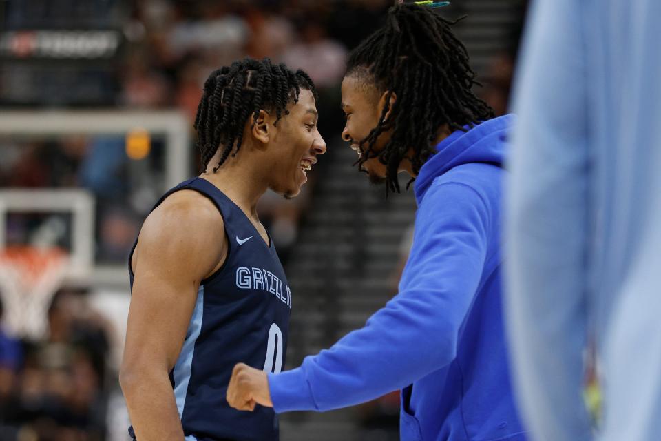 Memphis Grizzlies guard Kennedy Chandler (0) is congratulated by Ja Morant after a play during the second half the team's NBA summer league basketball game against the Philadelphia 76res on Tuesday, July 5, 2022, in Salt Lake City. (AP Photo/Jeff Swinger)