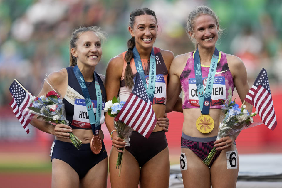 Valerie Constien, from right, Courtney Wayment and Marisa Howard pose after the women's 3000-meter steeplechase final during the U.S. Track and Field Olympic Team Trials Thursday, June 27, 2024, in Eugene, Ore. (AP Photo/Charlie Neibergall)