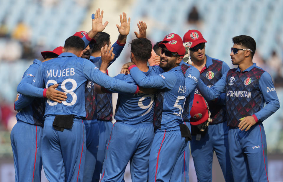 Afghanistan players celebrates the wicket of Netherlands' Max O'Dowd during the ICC Men's Cricket World Cup match between Afghanistan and Netherlands in Lucknow, India, Friday, Nov. 3, 2023. (AP Photo/Altaf Qadri)