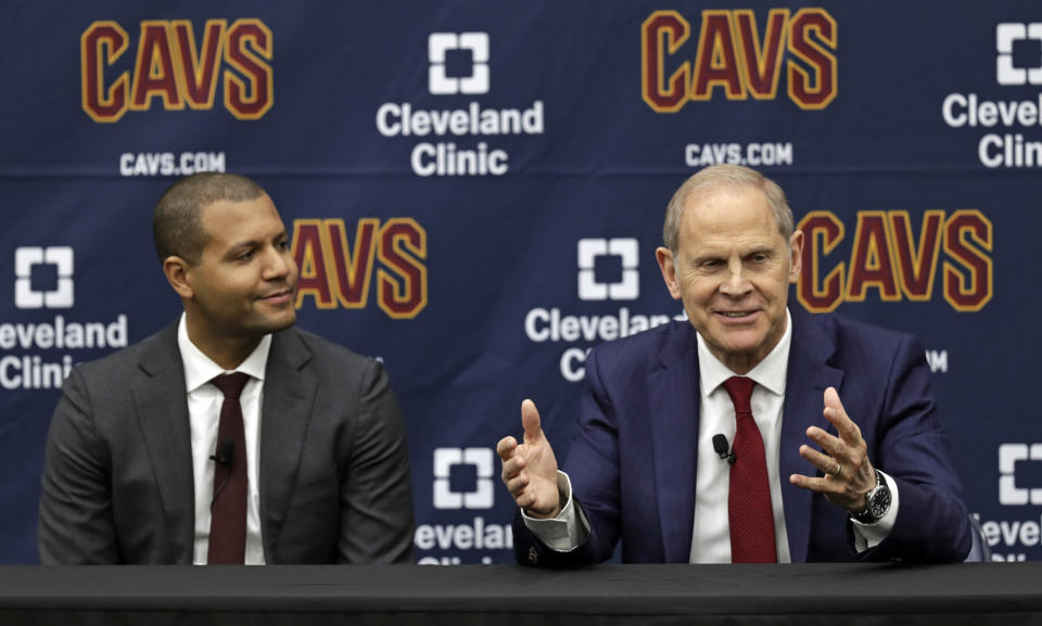 Cleveland Cavaliers head coach John Beilein, right, speaks during a news conference, Tuesday, May 21, 2019, in Independence, Ohio, as Cavaliers general manager Koby Altman, left, listens. Beilein left Michigan after a successful 12-year run for what will likely be his last coaching stop, the Cleveland Cavaliers, who believe the 66-year-old can accelerate their rebuild. (AP Photo/Tony Dejak)