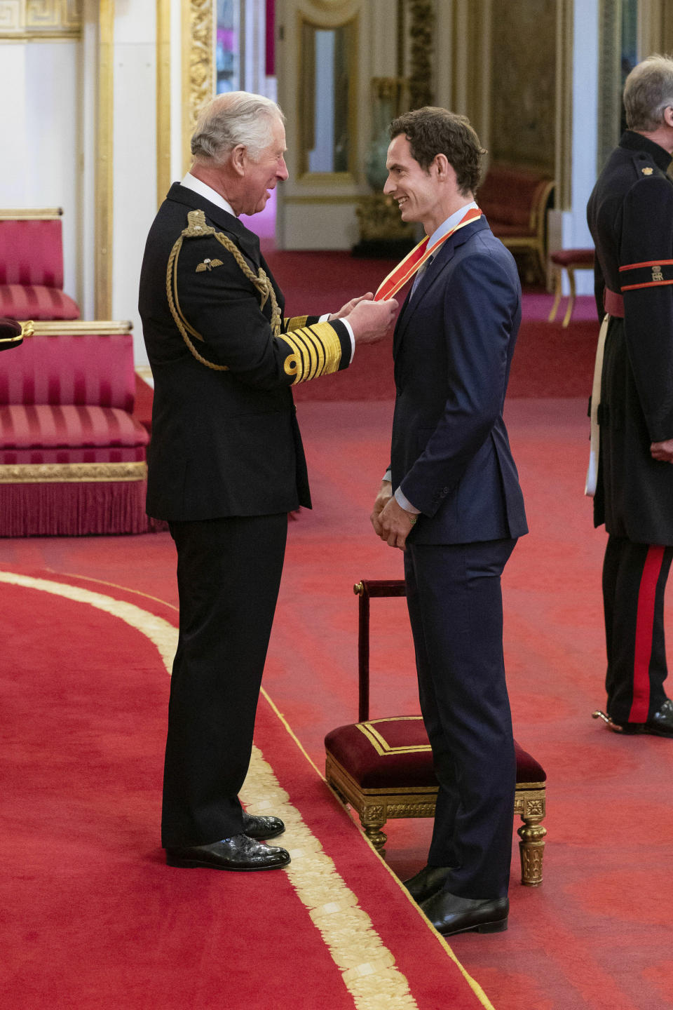 Britain's Andy Murray receives his knighthood from Prince Charles during an investiture ceremony at Buckingham Palace, London, Thursday May 16, 2019. (Dominic Lipinski/PA via AP)