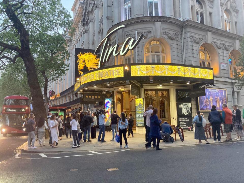 Fans gather outside The Aldwych Theatre in London on Wednesday night (PA)