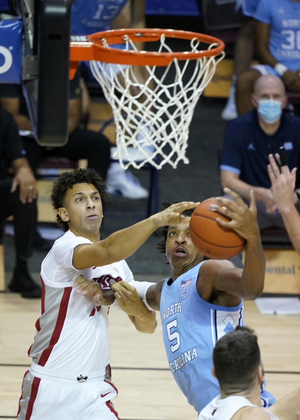 UNLV forward Reece Brown (15) and North Carolina forward Armando Bacot (5) fight for the ball under the basket in the second half of an NCAA college basketball game in the Maui Invitational tournament, Monday, Nov. 30, 2020, in Asheville, N.C. (AP Photo/Kathy Kmonicek)