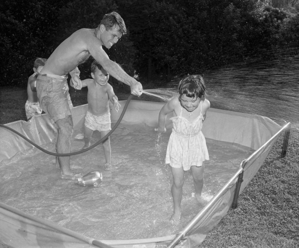 robert f kennedy and children at outdoor pool